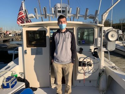 Spencer Kinyon on a boat