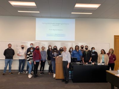 Mark Robbins standing with his last class of students